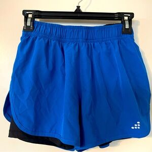 2 pairs of BCG running women’s shorts with black biker shorts liner